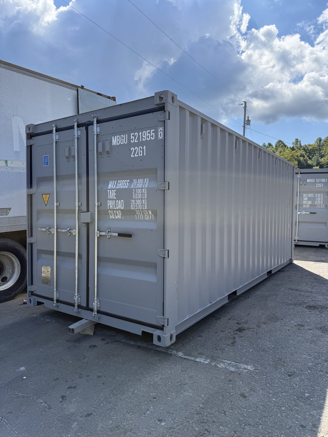 Cutaway view of a steel shipping container showing its welded lockbox and cargo doors